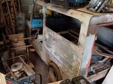 a small truck that is parked in a garage