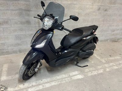 a scooter that is parked in a parking lot