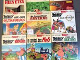 several children ' s cartoon books are lined up on a table