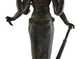 bronze statue of a woman holding a sword and a bird