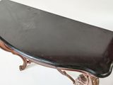 an image of a black marble topped table on a white background