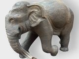 a statue of an elephant that is standing on its hind legs