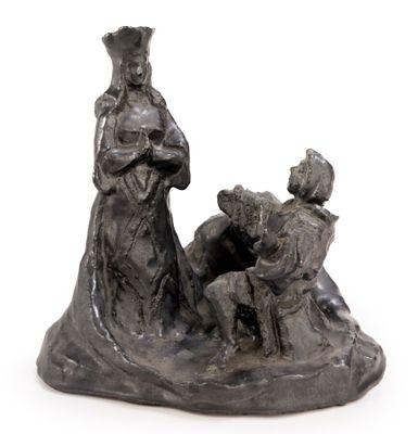 statue of a woman and two children in a boat with a man sitting on the boat
