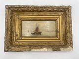 tableau représentant un voilier dans un cadre doré sur fond blanc