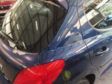 a blue car that is parked in a garage