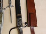three different types of knives on a table