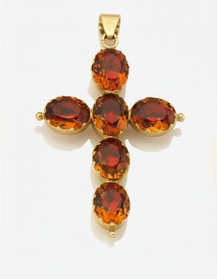 une image représentant une croix en or sertie de grenats sur fond blanc