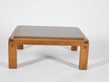an image of a small wooden table with a glass top on a white background