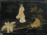 a black box with a painting of a woman and a dog