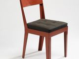 a wooden chair with a black seat on a white background