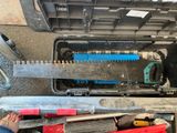 a person that is standing next to a tool box