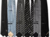 six different ties are lined up in a row on a white background