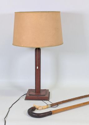 a lamp that has a cane and a lamp shade on it