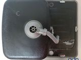 a black box with a venter and a hose attached to it