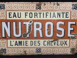 a sign that says nutrose on it on a black background