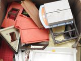 a cardboard box full of assorted items in it