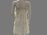 mannequin dressed in a white dress on a mannequin stand
