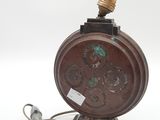 a lamp that is sitting on a table with a cord