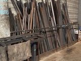 a large pile of wood and metal in a warehouse