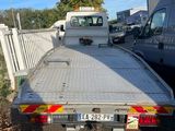 a truck that is parked next to a fence