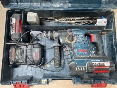 a tool box with tools in it sitting on the floor
