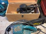 a box with tools in it sitting on the floor
