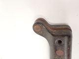 a close up of a metal object on a white surface