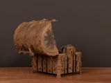 an old wooden model of a boat on a wooden table