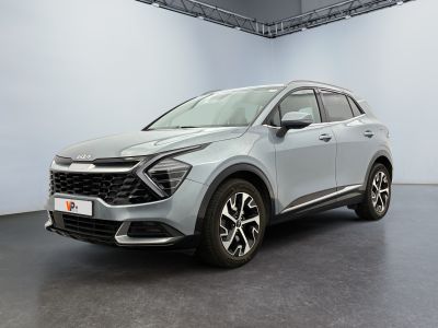 a silver suv parked in a large room with white walls