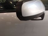 a close up of a car ' s side mirror on the side of the car