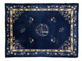 a blue rug with a floral design on it