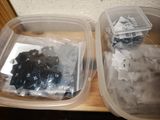 two plastic containers filled with different types of electrical components