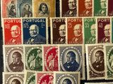 a group of stamps with different faces on them sitting on a table