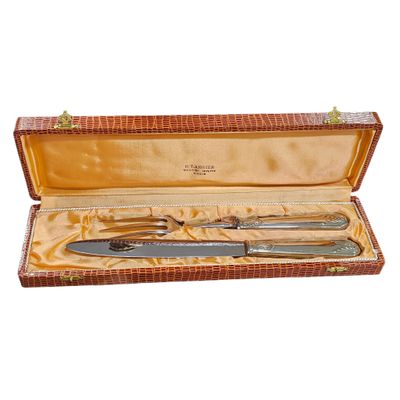 two knives and a fork in a case
