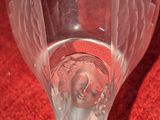 a glass with a picture of an angel inside of it