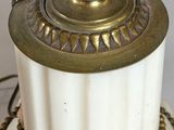 a close up of a lamp on a table with a chain around it