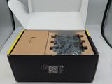 a box with some screws in it on a table