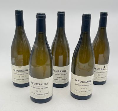 four bottles of wine are lined up on a white surface