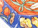a picture of a decorative plate with fruit and flowers on it