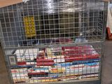 a cart with many books in it in a warehouse