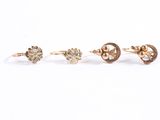 three pairs of gold and diamond stud earrings on a white background
