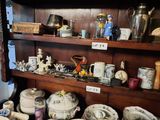many different types of china on the shelves in this room