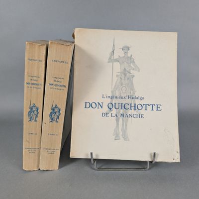 two books sitting on top of a metal stand next to each other