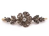a close up of a hair pin with flowers on it