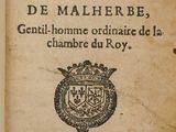 an old book with a picture of a coat of arms on top of it