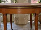 a wooden table with a wooden top on a tiled floor