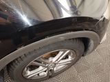 a close up of a car tire on the ground