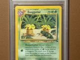 une carte à collectionner Pokémon sur laquelle figure l'image d'un personnage Pokémon