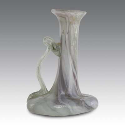 a glass vase that is sitting on a table