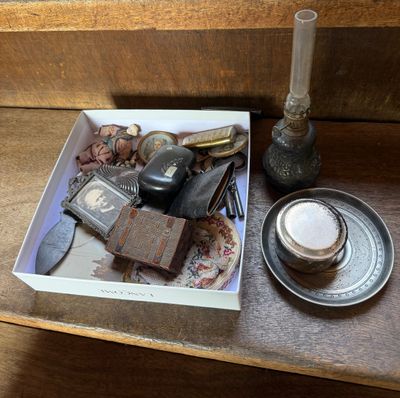 a box with a lot of items in it on a table